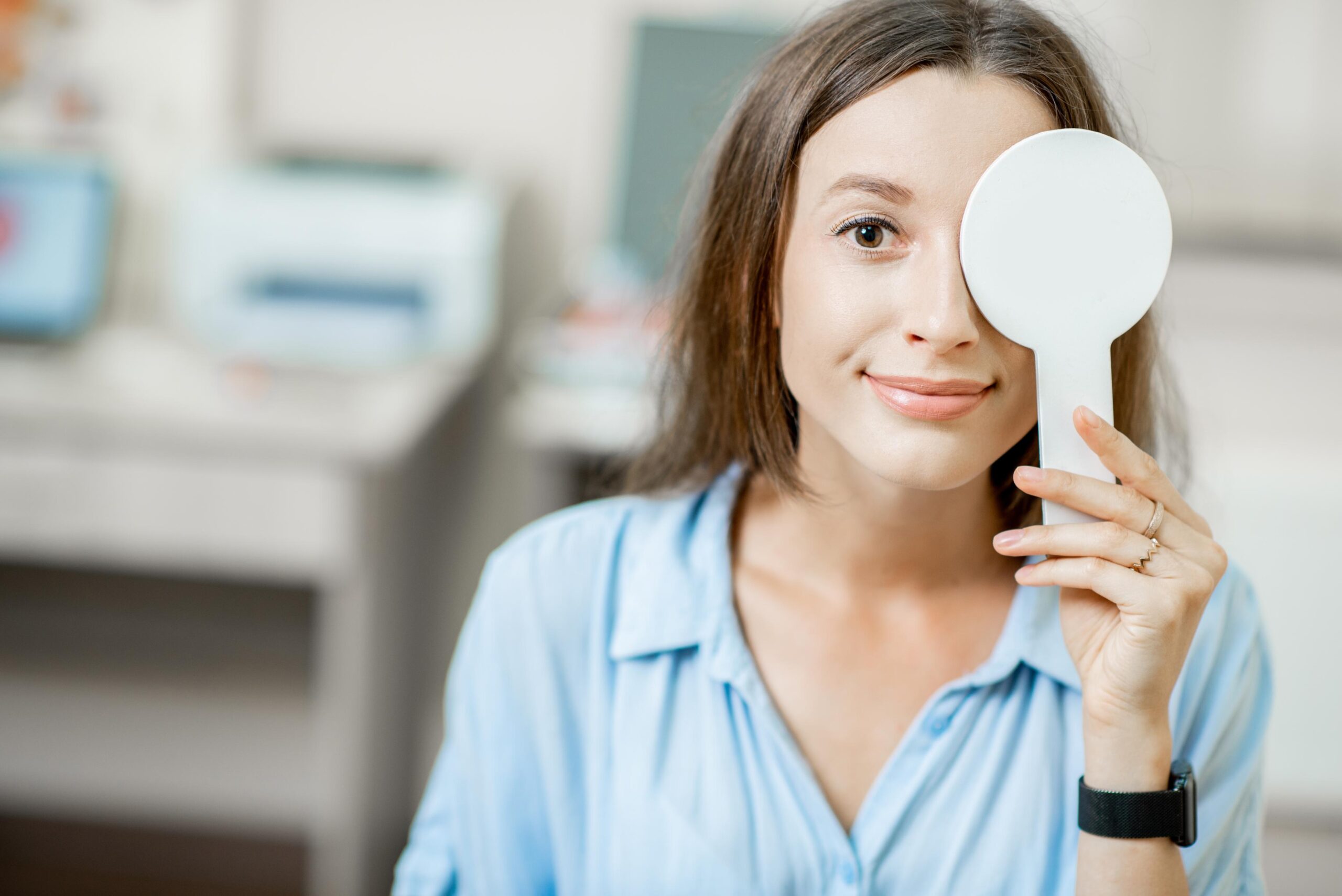 woman eye exam optometrist scaled